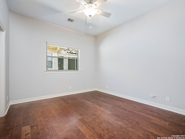 empty room featuring ceiling fan and hardwood / wood-style floors