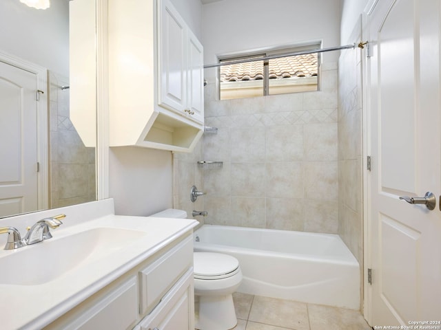 full bathroom with tiled shower / bath, vanity, toilet, and tile patterned flooring