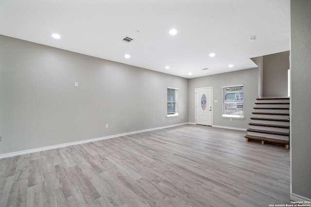 unfurnished living room with light wood-type flooring