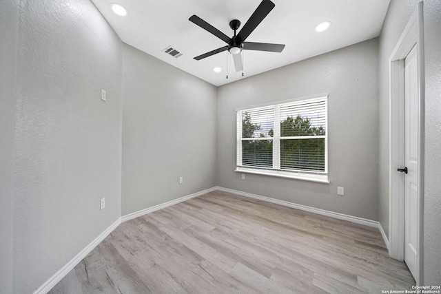 unfurnished room featuring light hardwood / wood-style flooring and ceiling fan