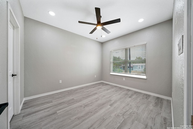 empty room featuring light hardwood / wood-style floors and ceiling fan