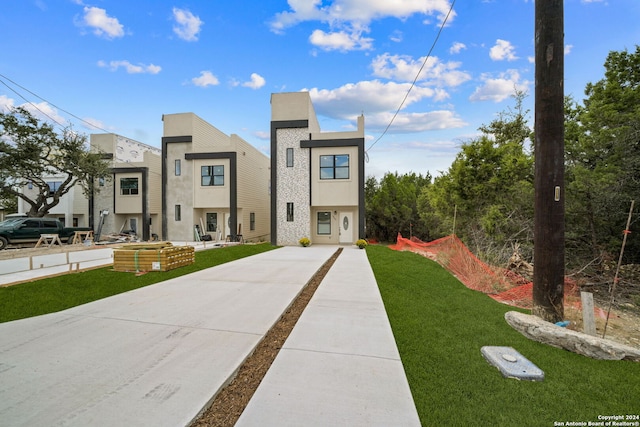 view of front of property with a front lawn