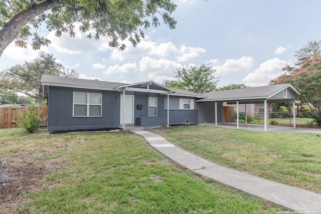 single story home featuring a carport and a front yard