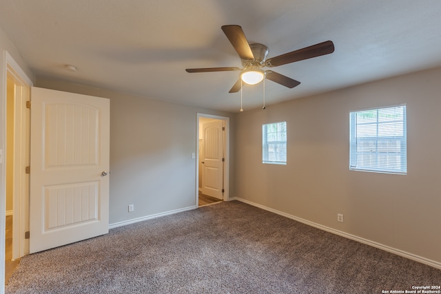 empty room featuring carpet and ceiling fan