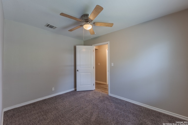 empty room with carpet and ceiling fan