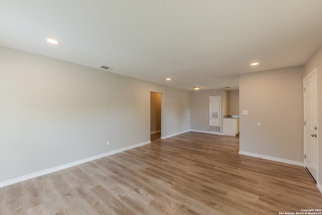 spare room with light wood-type flooring