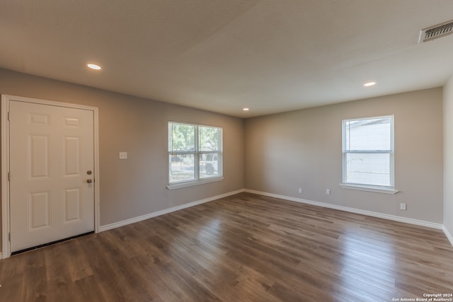 foyer entrance featuring dark hardwood / wood-style floors