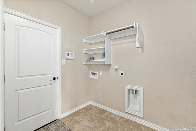 laundry area featuring hookup for an electric dryer, light tile patterned flooring, and hookup for a washing machine