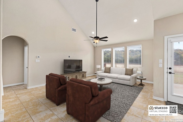 living room featuring ceiling fan, high vaulted ceiling, and light tile patterned flooring