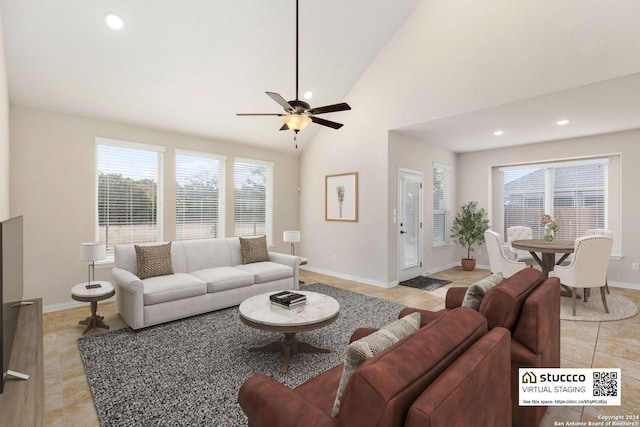 living room featuring light tile patterned floors, high vaulted ceiling, and ceiling fan