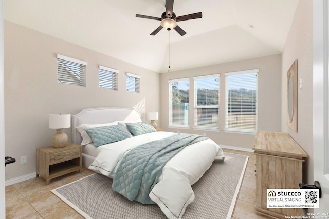 tiled bedroom with vaulted ceiling and ceiling fan