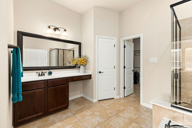 bathroom with vanity, an enclosed shower, and tile patterned floors