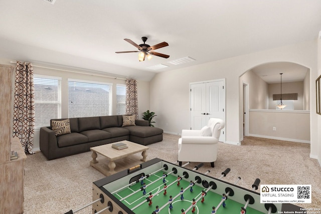 living room featuring carpet floors and ceiling fan