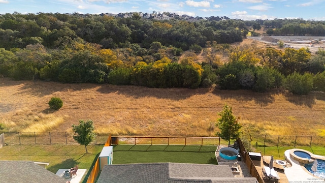 birds eye view of property with a rural view