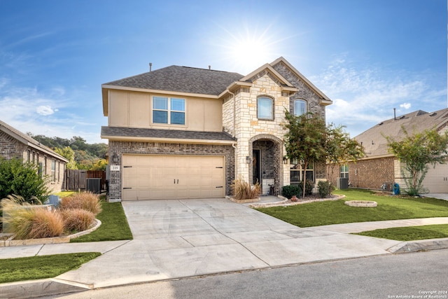 view of front facade featuring a front yard and a garage