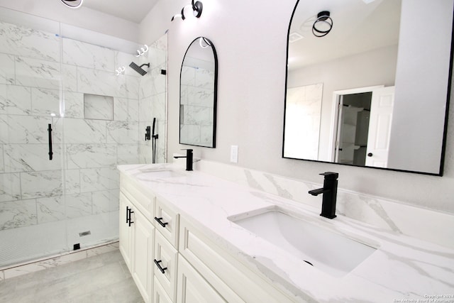 bathroom with vanity and a shower with shower door