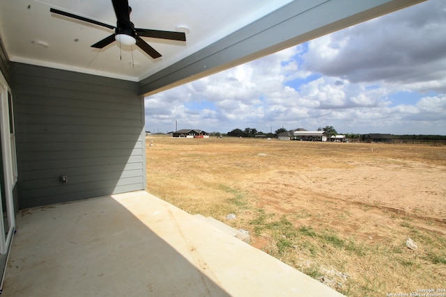 view of yard with ceiling fan