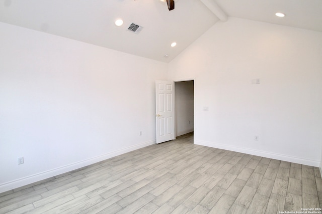 unfurnished room featuring high vaulted ceiling, beam ceiling, and light hardwood / wood-style floors