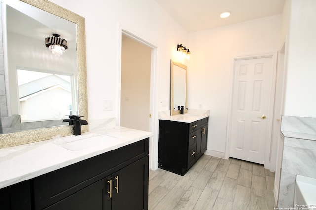 bathroom featuring vanity and wood-type flooring