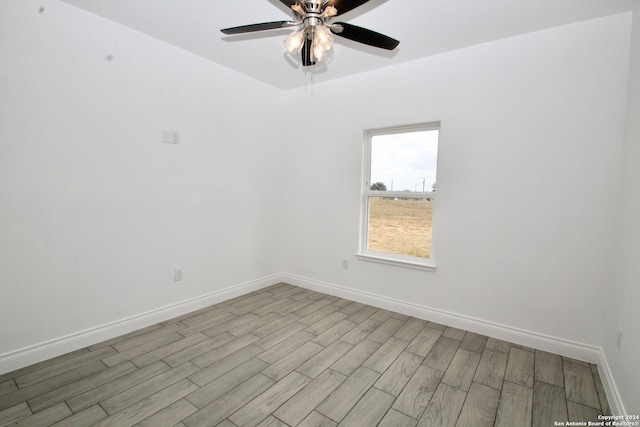 empty room with light hardwood / wood-style flooring and ceiling fan