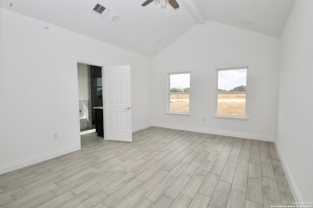 empty room with ceiling fan, high vaulted ceiling, beam ceiling, and light hardwood / wood-style floors