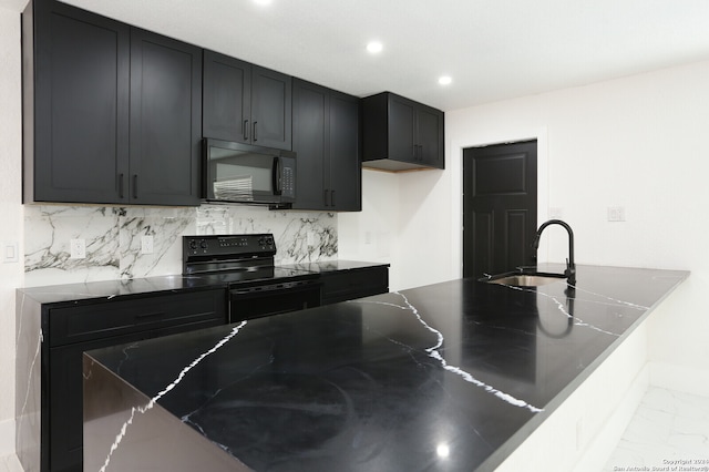 kitchen featuring sink, black appliances, and backsplash