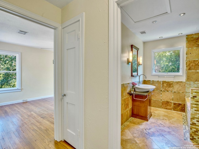 bathroom featuring vanity and hardwood / wood-style flooring