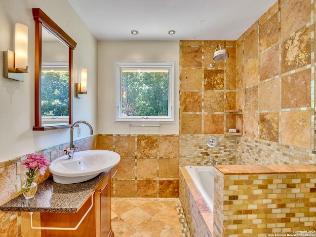 bathroom featuring vanity, independent shower and bath, and tile walls