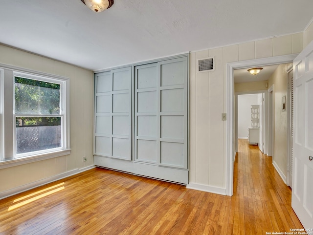 spare room with light wood-type flooring