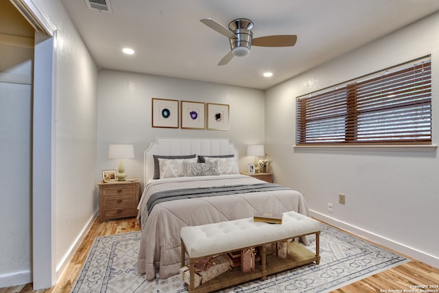 bedroom featuring light hardwood / wood-style floors and ceiling fan