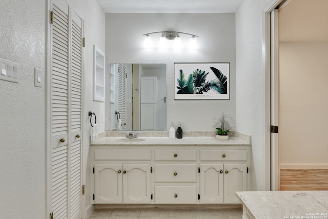 bathroom with vanity and hardwood / wood-style flooring