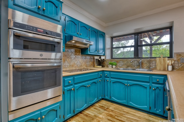 kitchen with light hardwood / wood-style floors, sink, ornamental molding, stainless steel double oven, and black electric stovetop