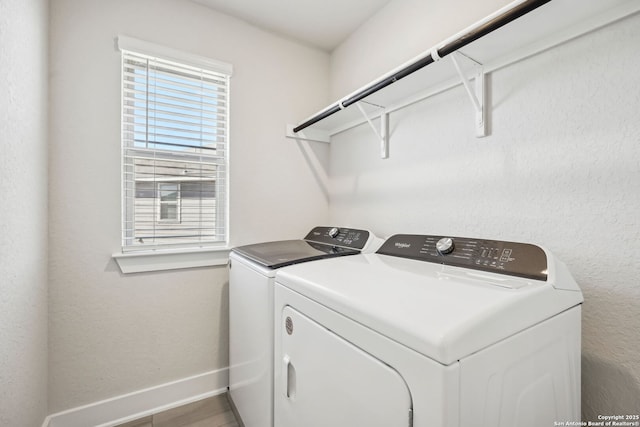 laundry room featuring washer and clothes dryer