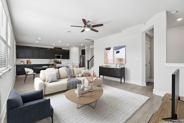 living room featuring ceiling fan