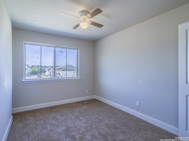 carpeted empty room with ceiling fan