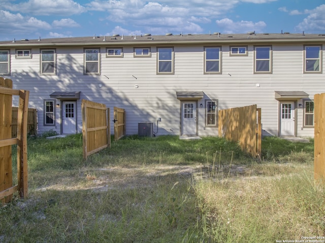 back of property with central air condition unit