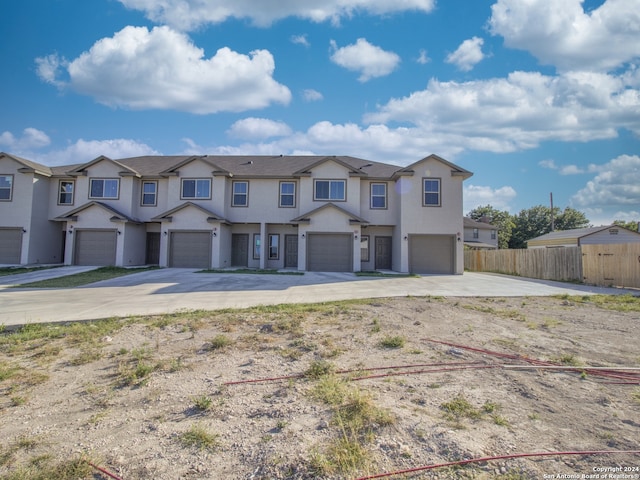 townhome / multi-family property with a garage