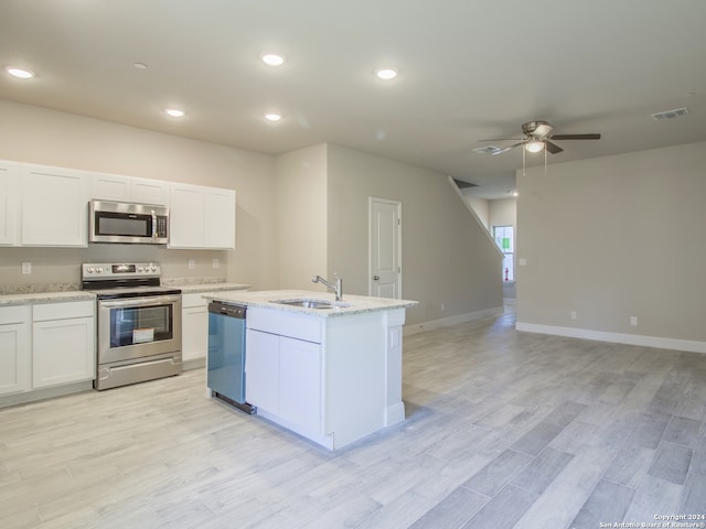 kitchen featuring light hardwood / wood-style floors, stainless steel appliances, sink, and white cabinets