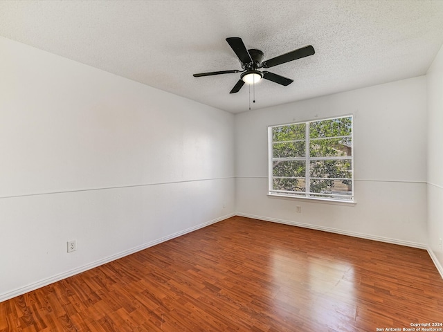 spare room featuring a textured ceiling, hardwood / wood-style flooring, and ceiling fan