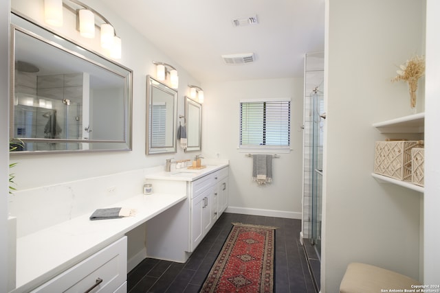 bathroom featuring vanity, hardwood / wood-style floors, and an enclosed shower