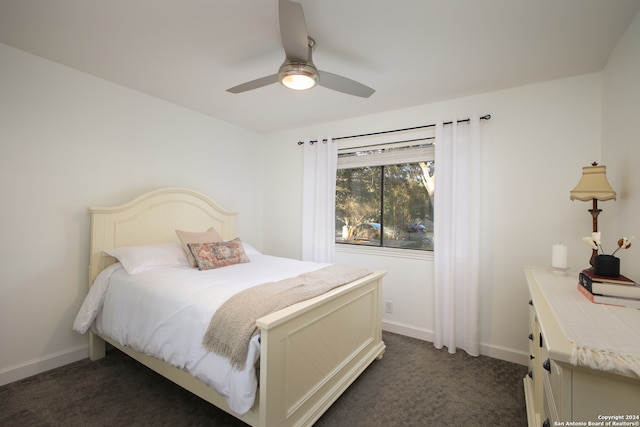 bedroom with dark carpet and ceiling fan