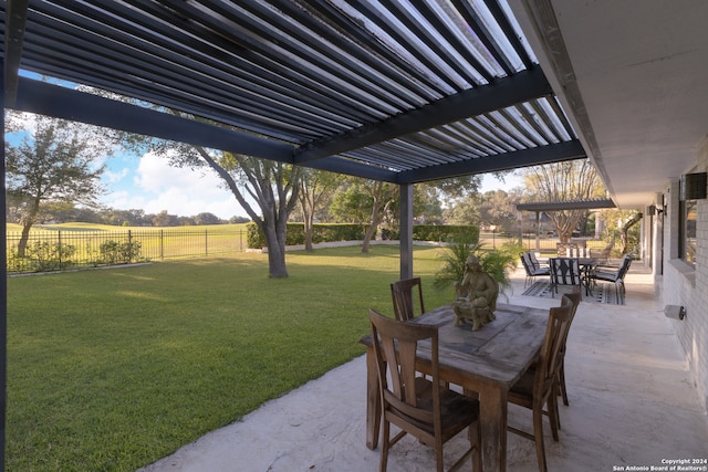 view of patio / terrace with a rural view and a pergola