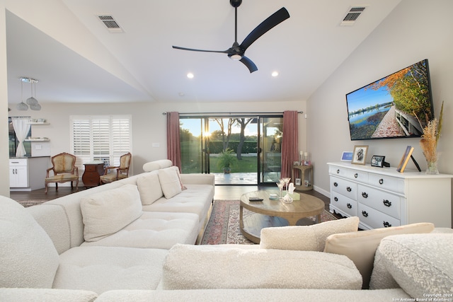 living room featuring lofted ceiling, wood-type flooring, and ceiling fan