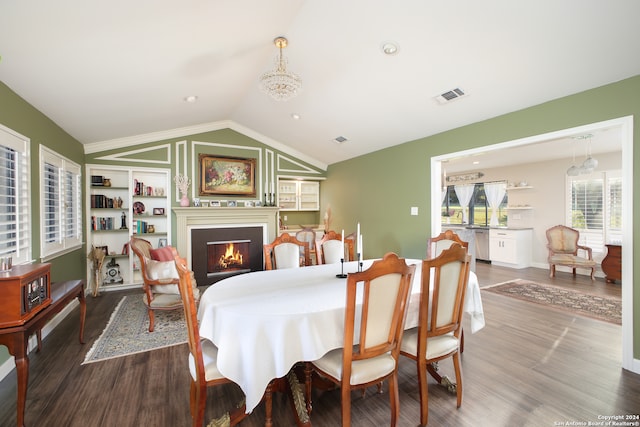 dining area featuring lofted ceiling and hardwood / wood-style flooring