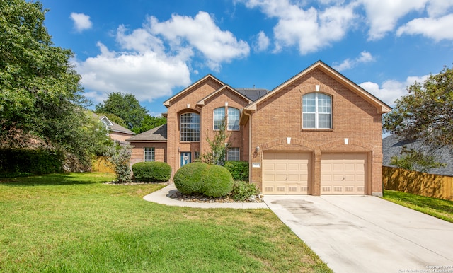 front facade featuring a front lawn and a garage