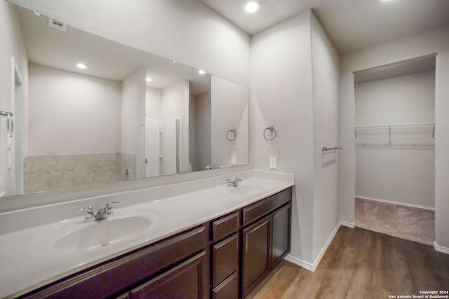 bathroom with vanity and hardwood / wood-style flooring