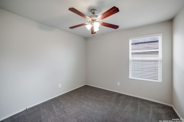 carpeted empty room featuring ceiling fan