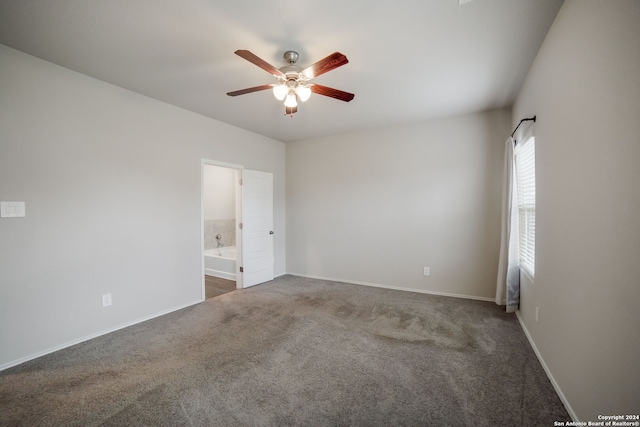 unfurnished room with dark carpet and ceiling fan