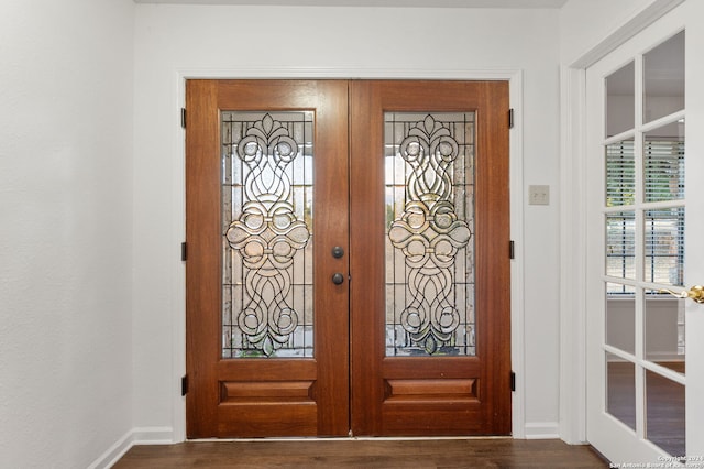 entryway with french doors and dark wood-type flooring