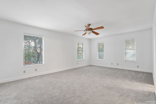 unfurnished room with carpet flooring and ceiling fan